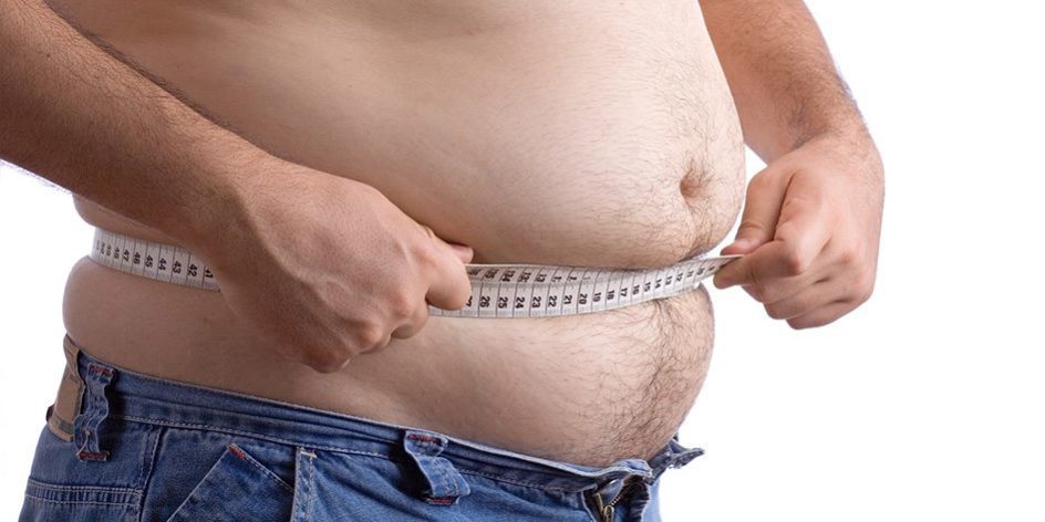 Fat man holding a measurement tape