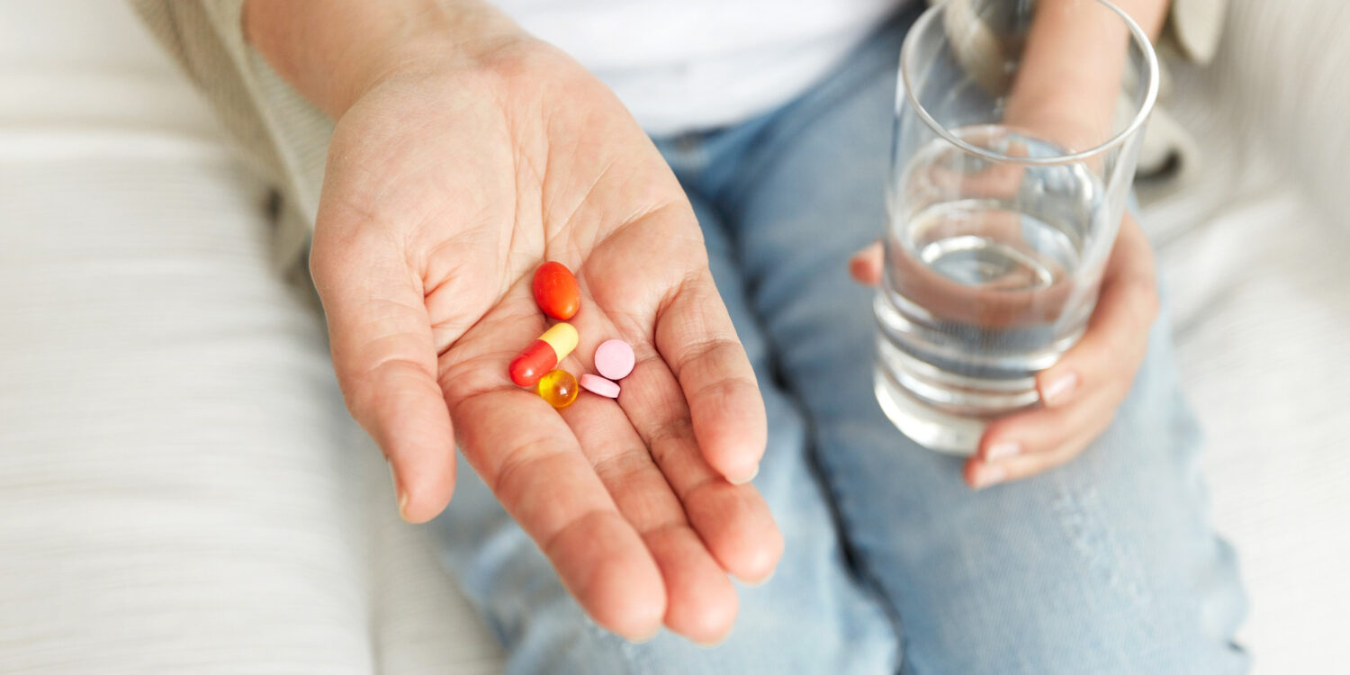 pills-tablets-vitamins-drugs-heap-mature-hands