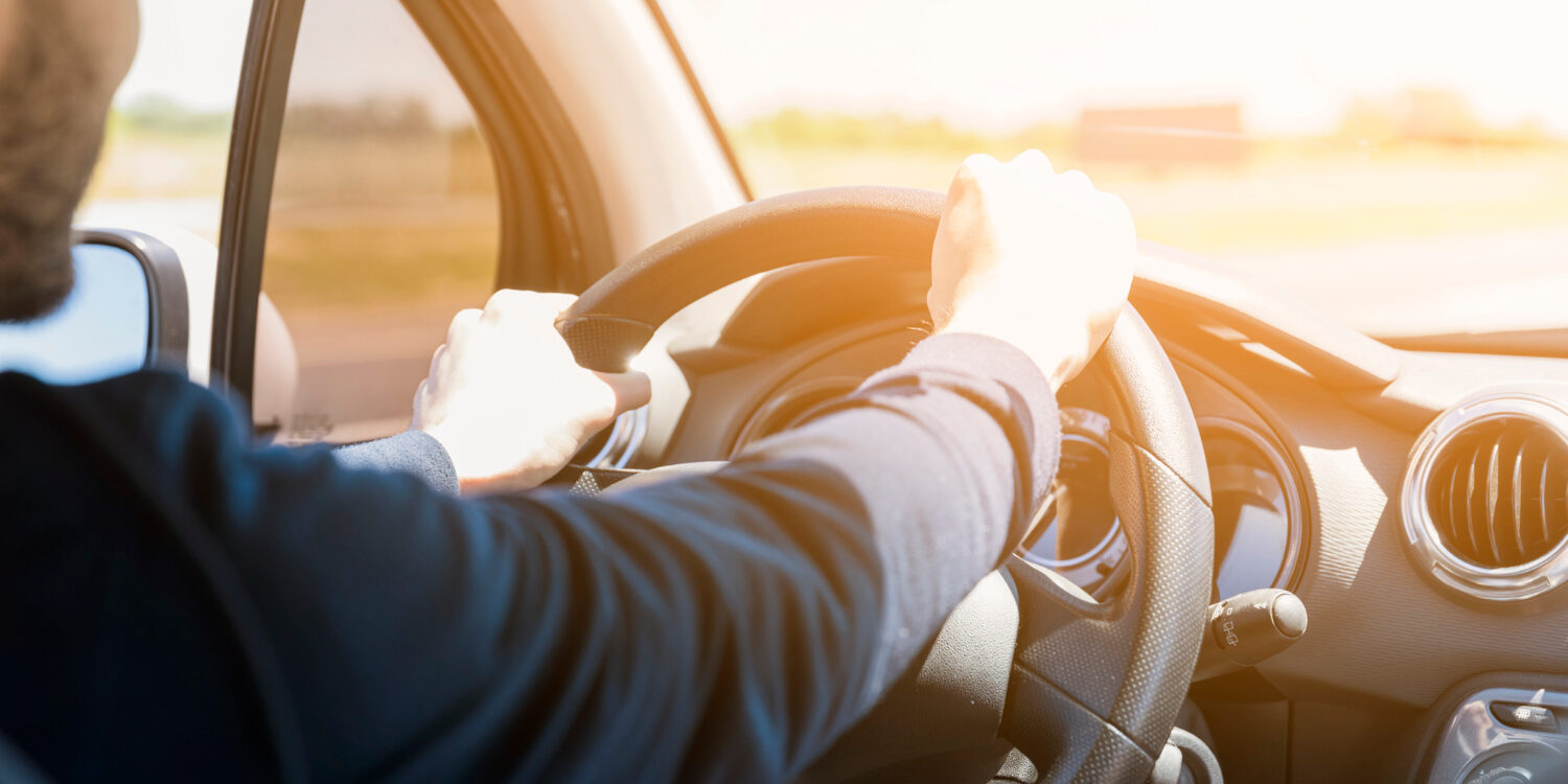 steering-wheel-illuminated-by-ray-sun
