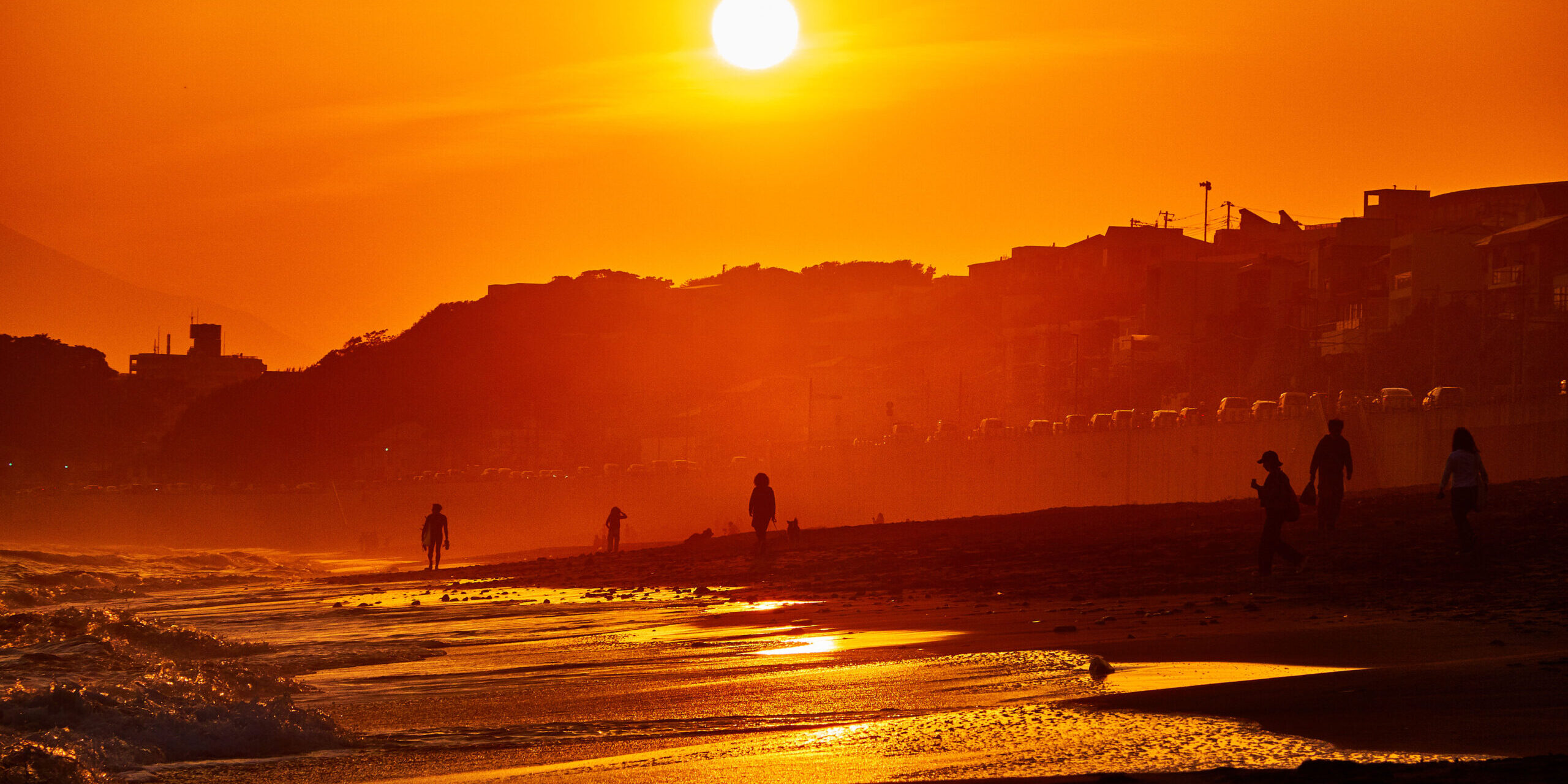silhouette-people-beach-against-sky-sunset